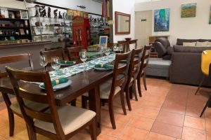 Tico gallery high-quality wooden dining table and decorations in Atenas, Costa Rica